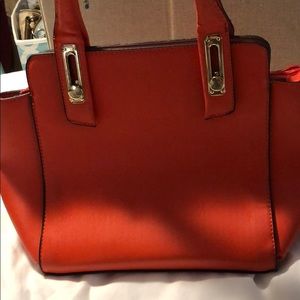 Orange handbag/sachem. My favorite pieces.